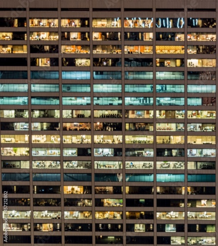 Office windows illuminated at night