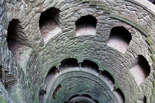 Pozo Iniciático (Quinta da Regaleira, Portugal): Ceremonial well that belongs to a palace complex and houses a spiral staircase that leads to a system of tunnels photo