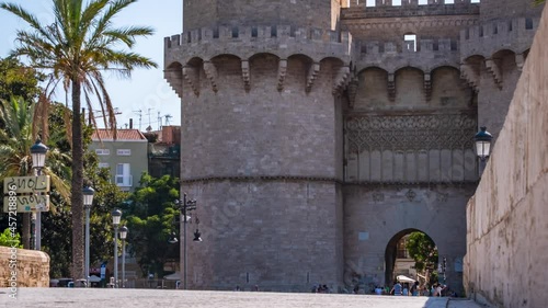 Valencia Spain Torres de Serranos ancient tower timelapse, tourists excursion and landmark