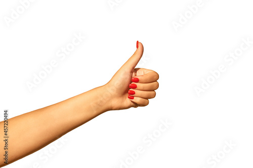Girl's hand with thumb raised up isolated on white background