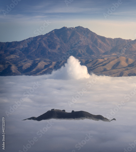 Fog in the hills of Silicon Valley, California, with Mt. Hamilton in the background. photo