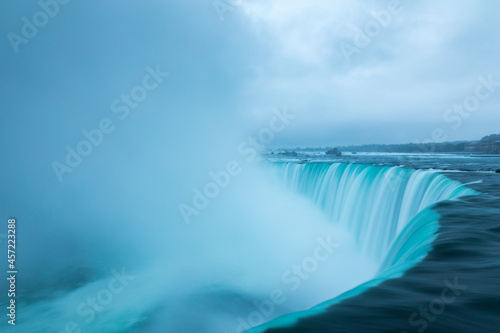 A stormy morning over the iconic Niagara Falls located on the boarder of the United States and Canada.