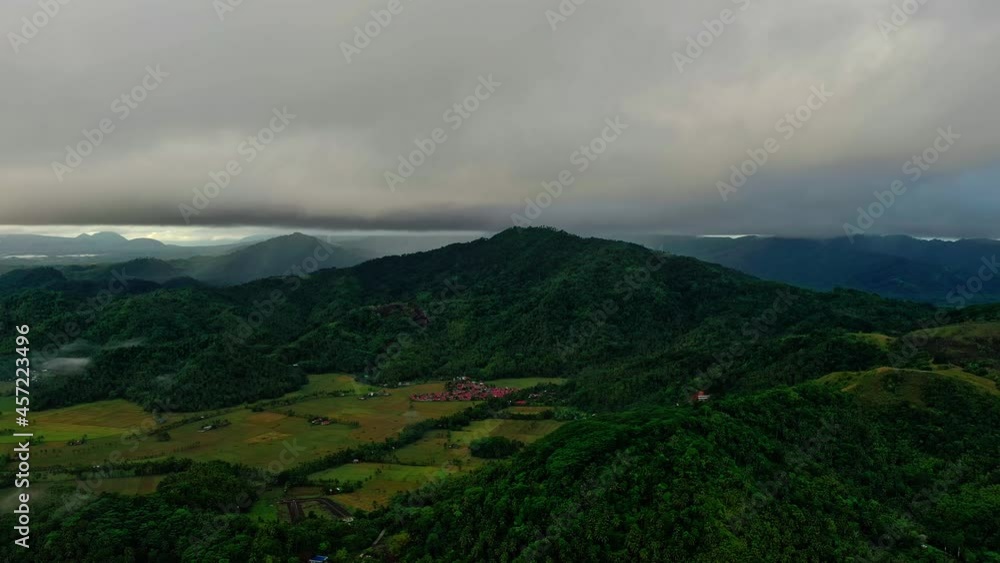 Rice files and jungle hills in Surigao Philippines. Camera tracking left right Rice files and jungle hills in Surigao Philippines. Camera tracking left right