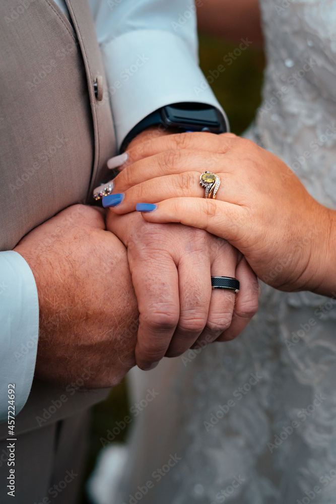 bride and groom holding hands