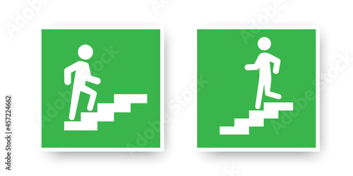 Go down and up stairs icon in white frame on green backdrop. Emergency evacuation. Vector illustration. Stock image.