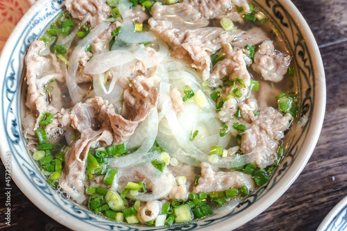 Vietnamese style rice noodles with a lot of beef. photo