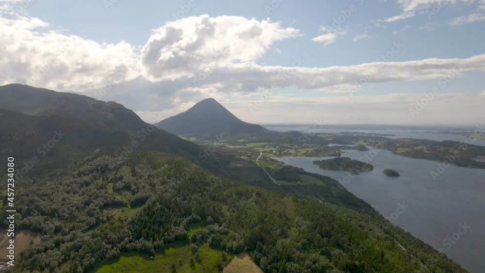 Cone-shaped Jendemsfjellet mountain next to Haroy fjord, Norway Cone-shaped Jendemsfjellet mountain next to Haroy fjord, Norway