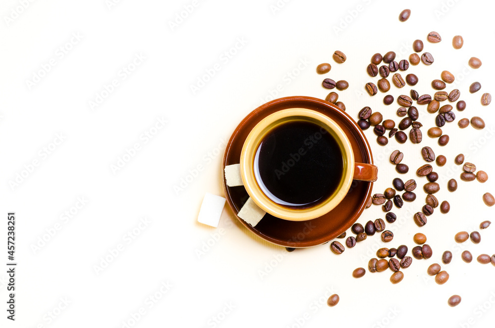 Coffee old Scandinavian style cup and saucer with grains and sugar cubes. Light background. Close-up. Coffee old Scandinavian style cup and saucer with grains and sugar cubes. Light background. Close-up.