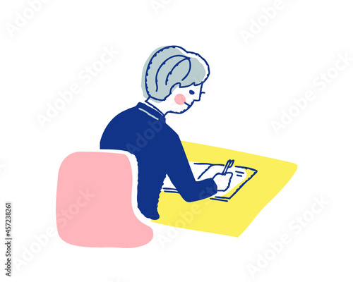 机に向かって勉強している男の子