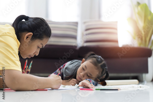 Asian mother and daughter teaching homework, Study From Home idea concept