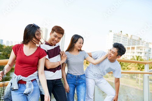 Two young couples having fun together when spending time outdoors