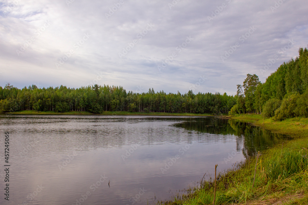 Siberian river landscape. Summer colorful landscape on the shore of a reservoir in Siberia.