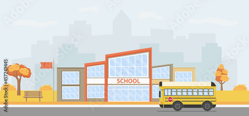 Fototapeta Naklejka Na Ścianę i Meble -  Vector illustration of a modern school building with a school bus.