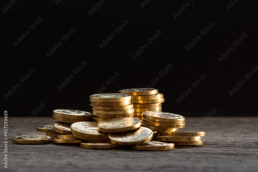 many yellow, gold coins are stacked on the table, business growth, deposit, compound interest concept many yellow, gold coins are stacked on the table, business growth, deposit, compound interest concept
