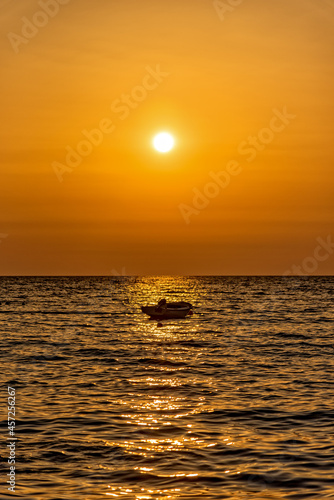 A boat at sunrise on the Adriatic Sea