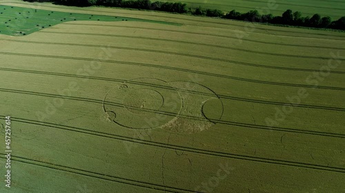 Wootton rivers Wiltshire paranormal crop circle pattern in green farmland field aerial drone view rotating right photo