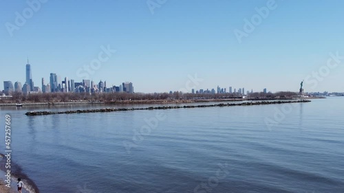 NYC Lower Manhattan Skyline with Laby Liberty, view from Caven Point in New Jersey across Hudson River photo