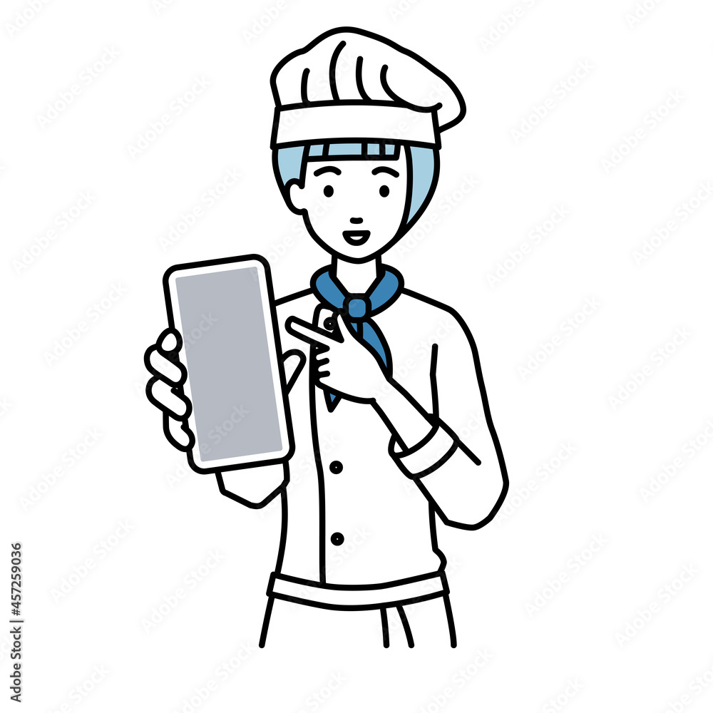 立ってスマートフォンを指差してこちらに向けて見せている調理師の女性 立ってスマートフォンを指差してこちらに向けて見せている調理師の女性