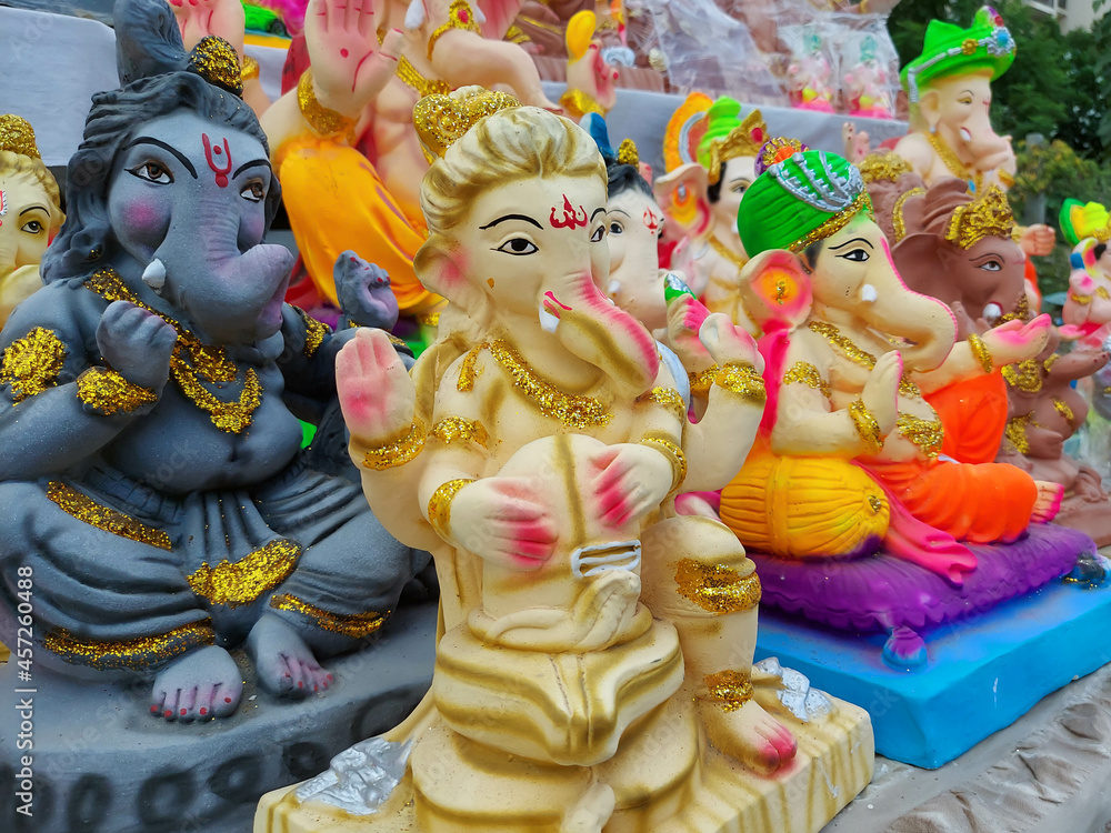 Eco Friendly Statue Of Indian Lord God Ganesha Bapa Also Called Bhagwan Ganpati Bappa Morya Deva Shubh Labh. Idol Is Used For Worship On Ganesh Chaturthi Jayanti Diwali, Deepavali and Deepawali Eco Friendly Statue Of Indian Lord God Ganesha Bapa Also Called Bhagwan Ganpati Bappa Morya Deva Shubh Labh. Idol Is Used For Worship On Ganesh Chaturthi Jayanti Diwali, Deepavali and Deepawali
