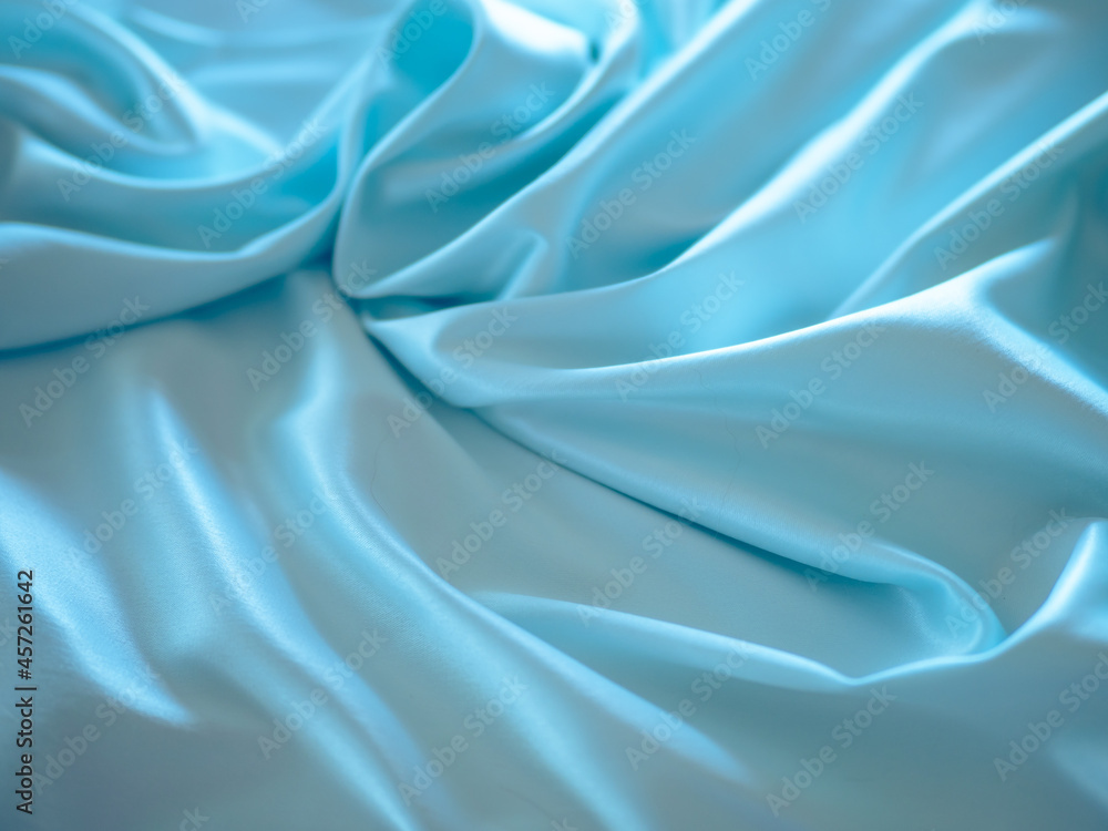 Soft fabric with beautiful folds of light color in a blur. Soft fabric with beautiful folds of light color in a blur.