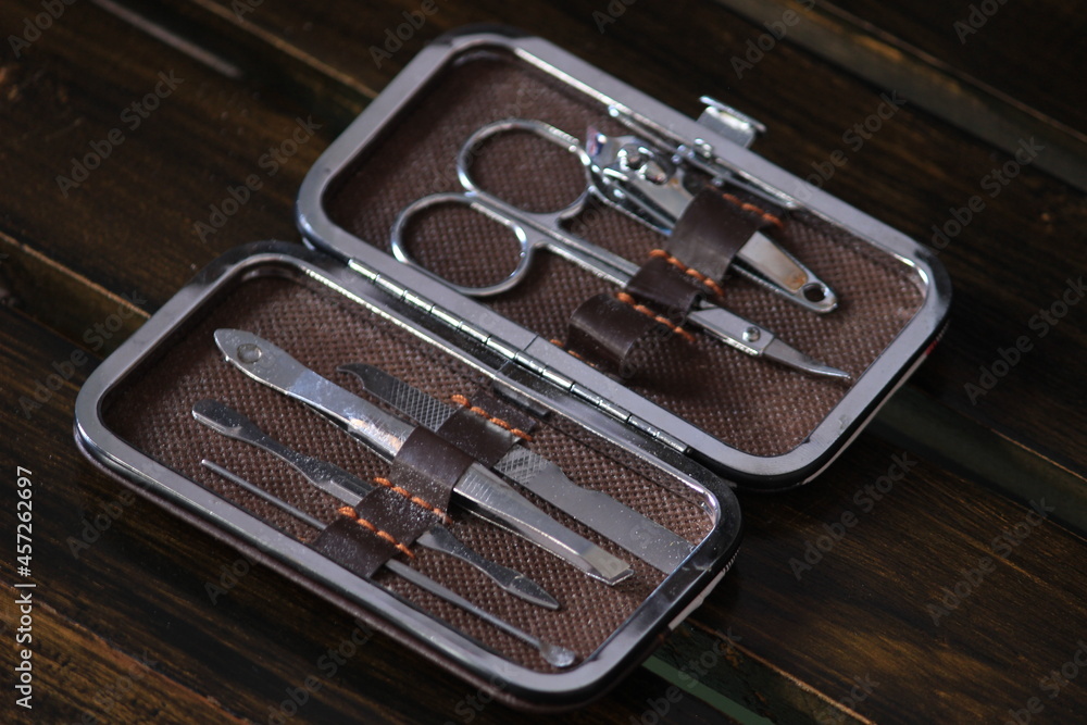 a set of self-care tools in a unique box. consists of nail clippers, scissors, hair removal tools, ear cleaning tools and others. a set of self-care tools in a unique box. consists of nail clippers, scissors, hair removal tools, ear cleaning tools and others.