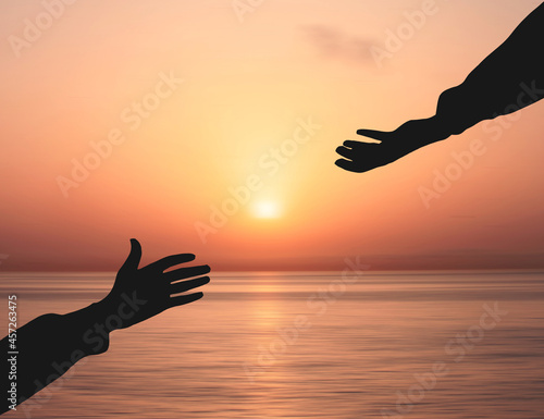 Hand Asking help From god  and Get Hired Concept. Helping Hand Against Sunrise Ocean background. People helping and God salvation Concepts