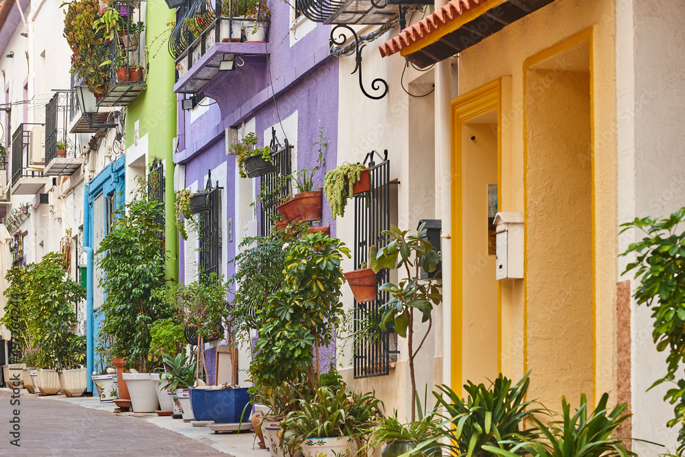 Picturesque colored facades in Calpe old town. Mediterranean coast. Alicante