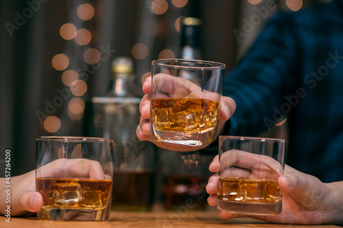 Fototapeta Naklejka Na Ścianę i Meble -  Celebrate whiskey on a friendly party in  restaurant