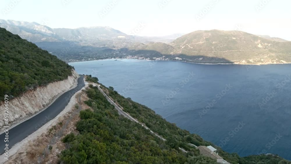 car travel concept aerial view of mountain road near sea at lefkada island car travel concept aerial view of mountain road near sea at lefkada island