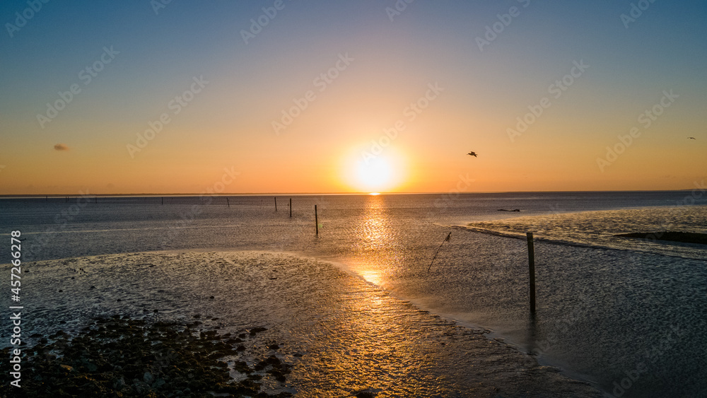Sunrise at the coast of the Wadden Sea at the North Sea in Germany - Drone Perspective Landscape Photography