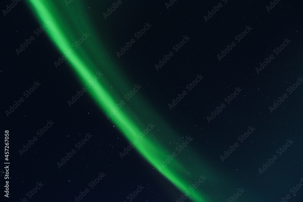 northern lights against the background of the starry sky. aurora borealis in winter night