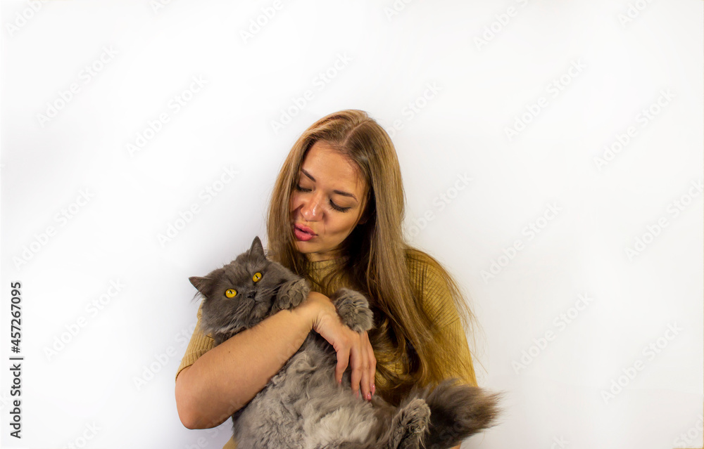 young beautiful woman with cat visiting the veterinarian