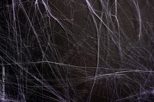 white spider web texture horror black background © Nastya