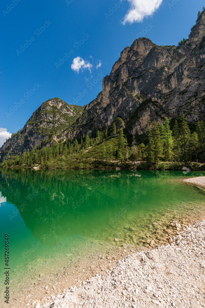 Pragser Wildsee or Lago di Braies. Alpine lake and the Mountain peaks of the small and great Apostle, Dolomites, UNESCO world heritage site, South Tyrol, Trentino-Alto Adige, Bolzano, Italy, Europe.
