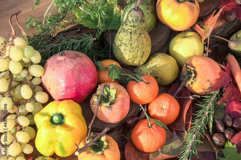 rustic autumn composition of fruits and