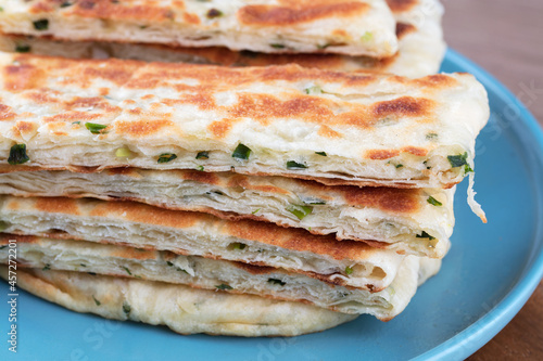A plate of freshly made green onion pancakes