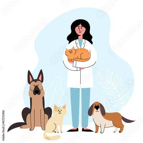 Veterinarian standing with cats and dogs on vet interior