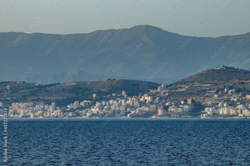 Saranda, Albania, seen from far away in Adriatic Sea, spring day sailing