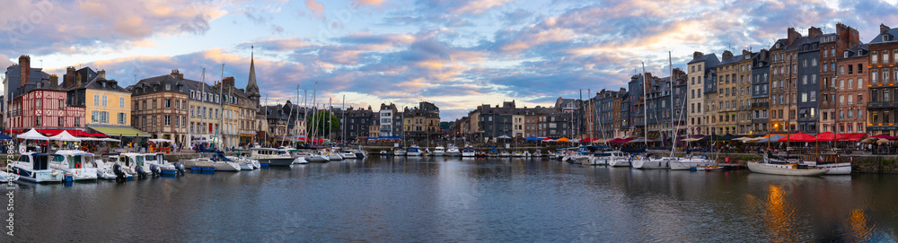 Honfleur, France - July 28, 2021: Honfleur is a french commune in the Calvados department and famous tourist resort in Normandy. Especially known for its old port.