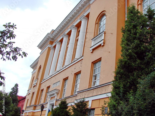The view of an outside spectator on the brightly colored building of the scientific library bordering on Shevchenko University.
