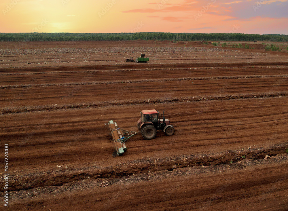 Peat Harvester Tractor on Collecting Extracting Peat. Mining and