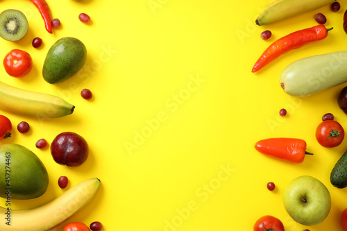Fototapeta Naklejka Na Ścianę i Meble -  Set of different vegetables and fruits on yellow background