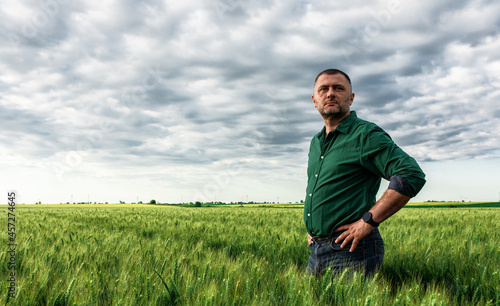 Portrait of farmer standing in wheat field. © Zoran Zeremski