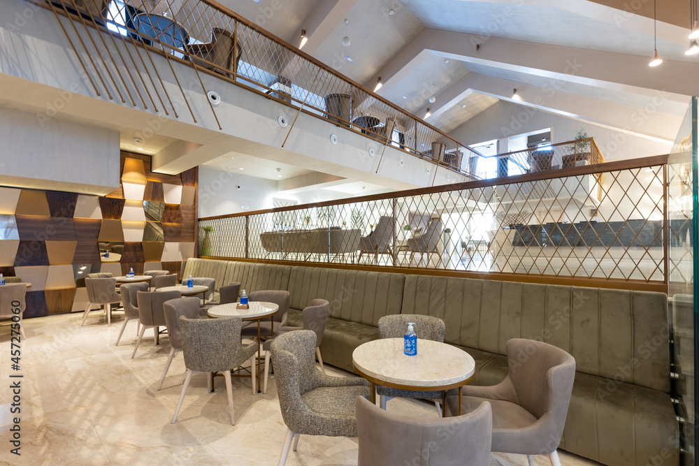 Interior of a spacious cafe bar in hotel lobby Interior of a spacious cafe bar in hotel lobby