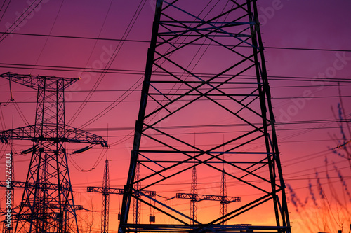 Transmission line, natural energy. electric pillars on sunset. high voltage post.High-voltage tower sky background.