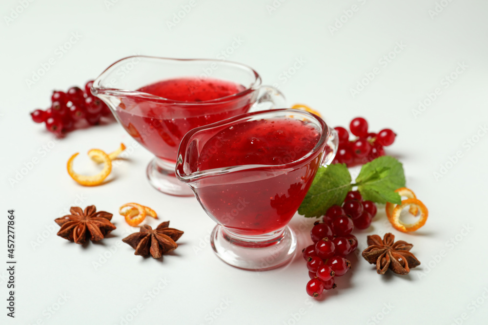 Cranberry sauce and ingredients on white background Cranberry sauce and ingredients on white background