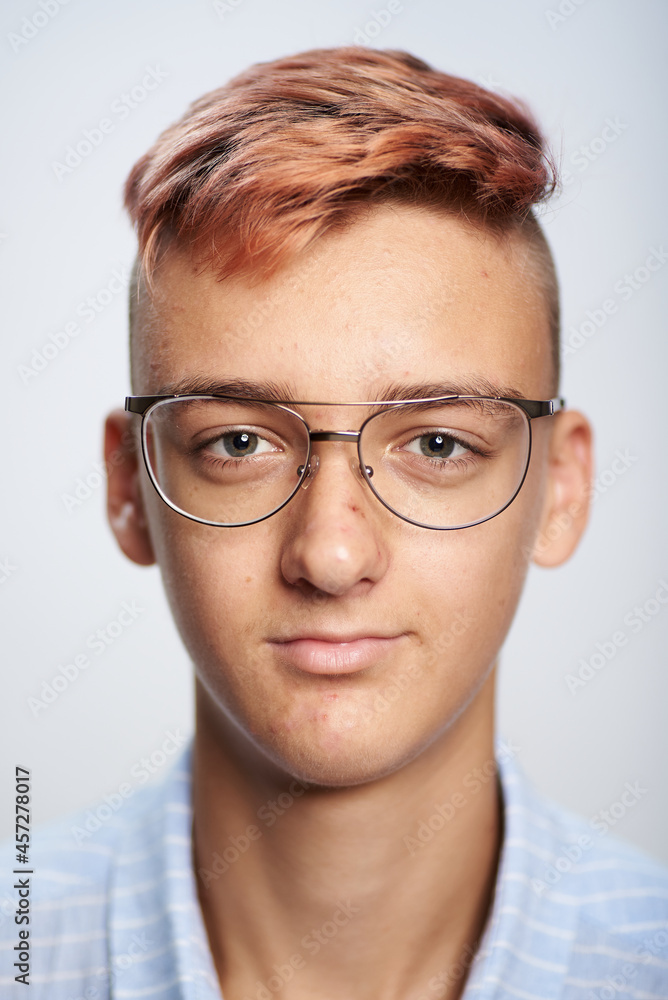 Photo of a teenage boy wearing glasses 16 years old in a shirt for a document