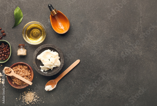 Different natural ingredients for homemade cosmetics on dark background