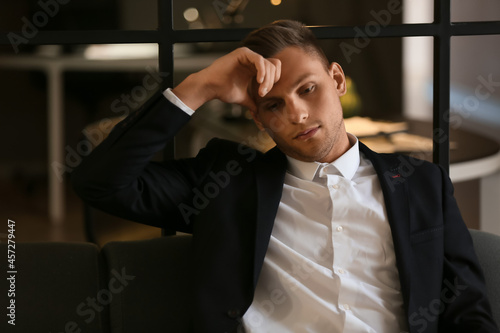 Depressed young businessman...