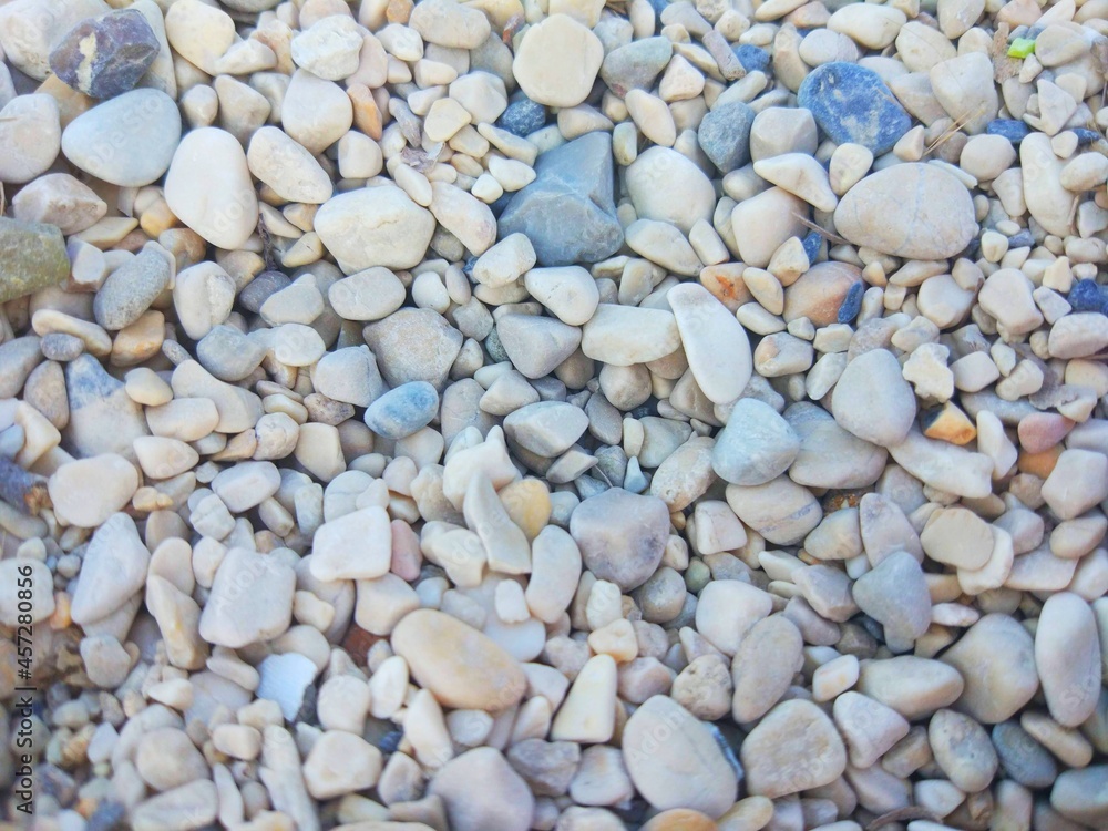 Texture of sea pebbles, dark and light stones Texture of sea pebbles, dark and light stones